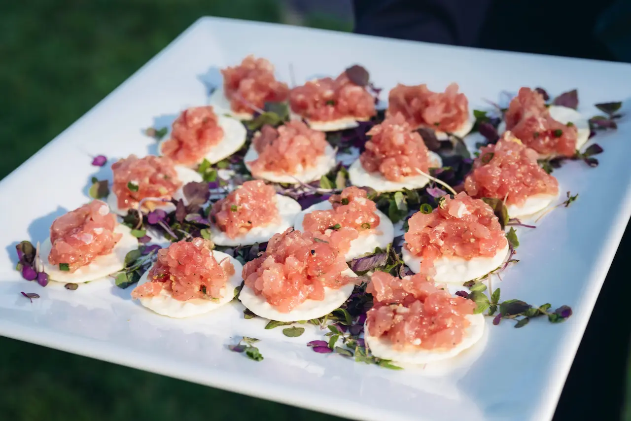 tented outdoor wedding venue in the hudson valley salmon tartar served on crackers