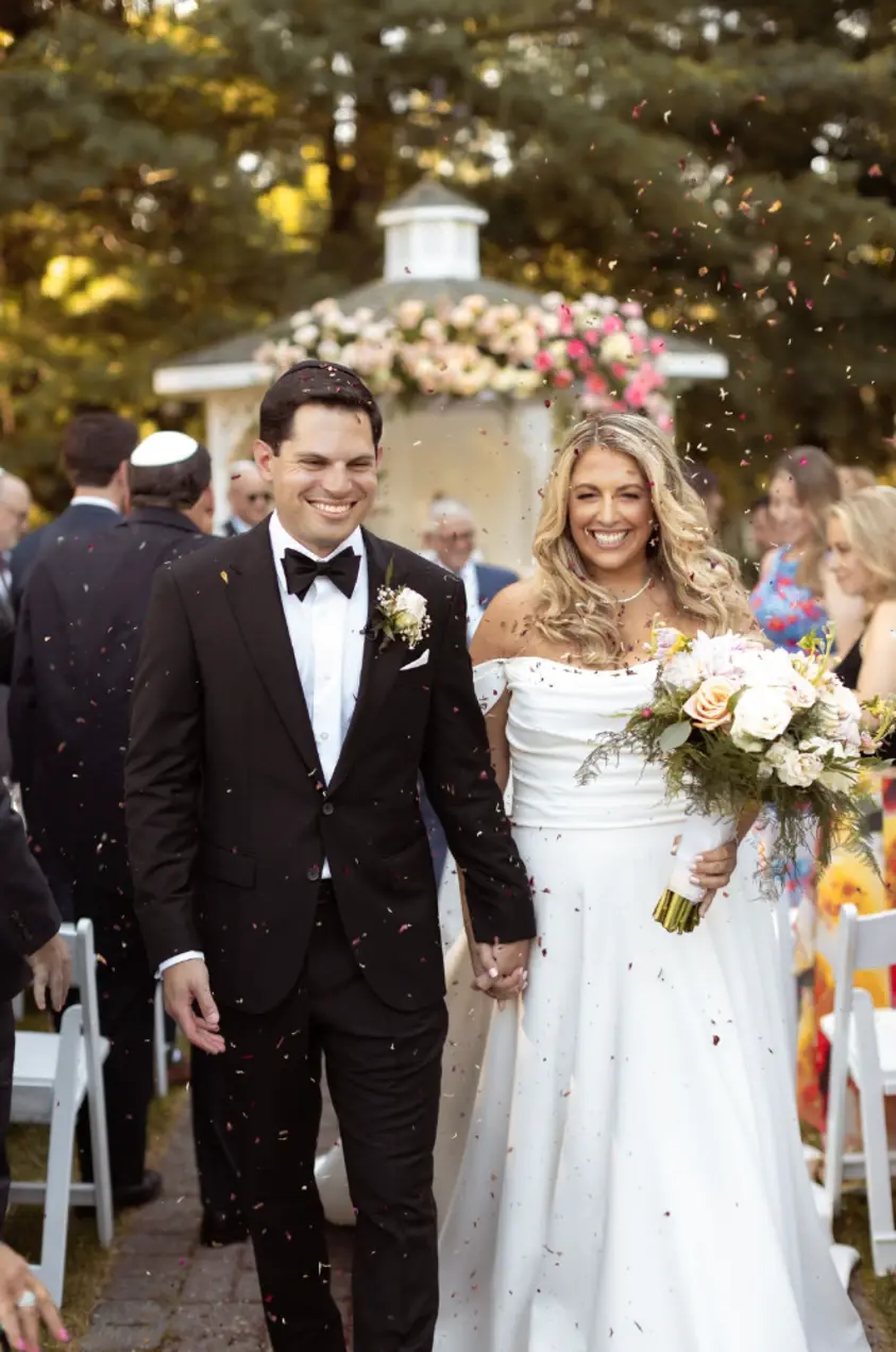 happy couple leaving gazebo ceremony